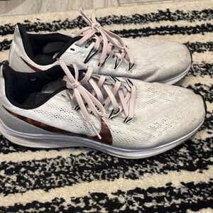 Nike Women’s Athletic Shoes in White with Light Pink Laces and Bronze Swoosh